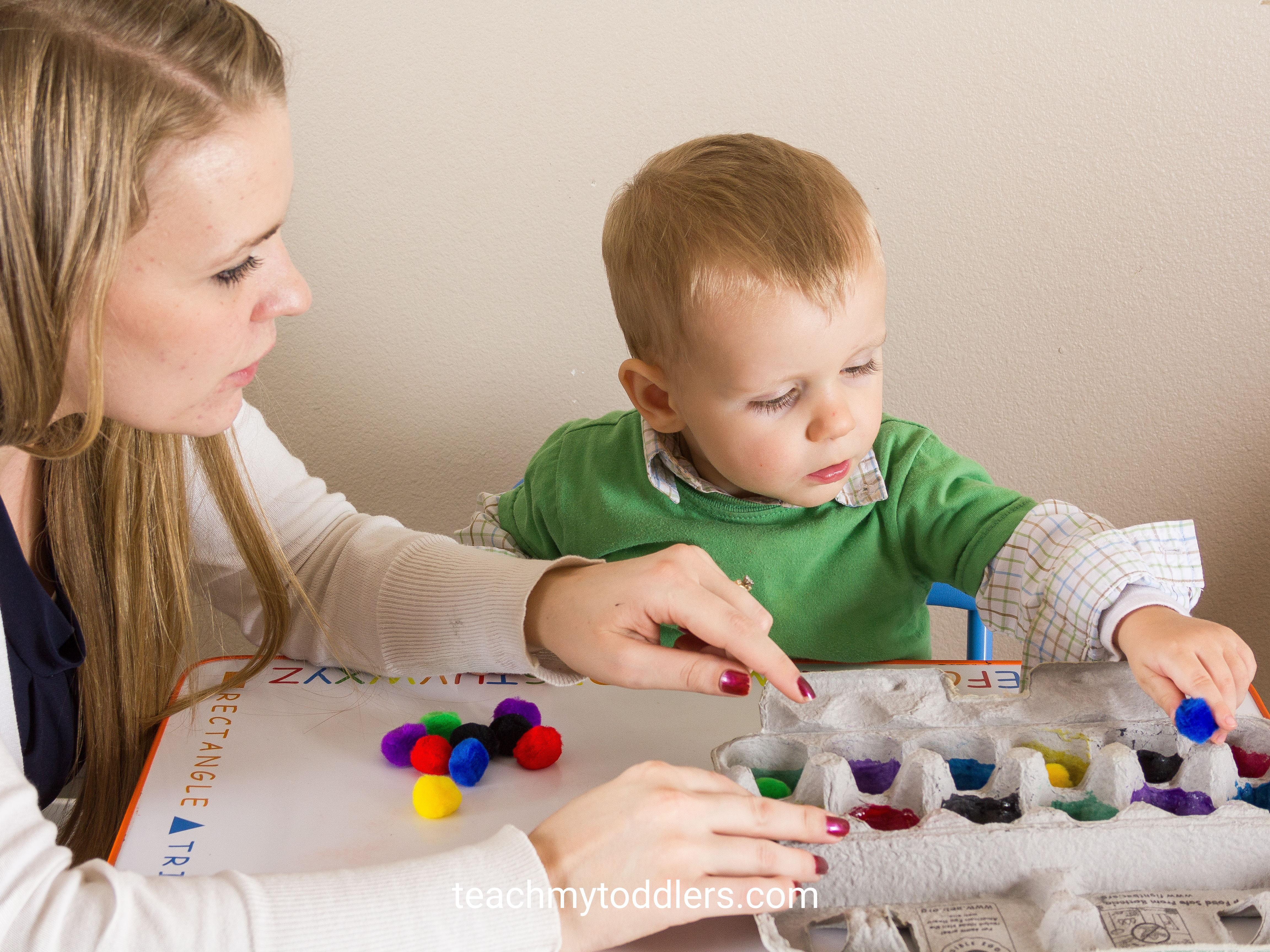 Teach your toddler colors with this egg carton and pom poms