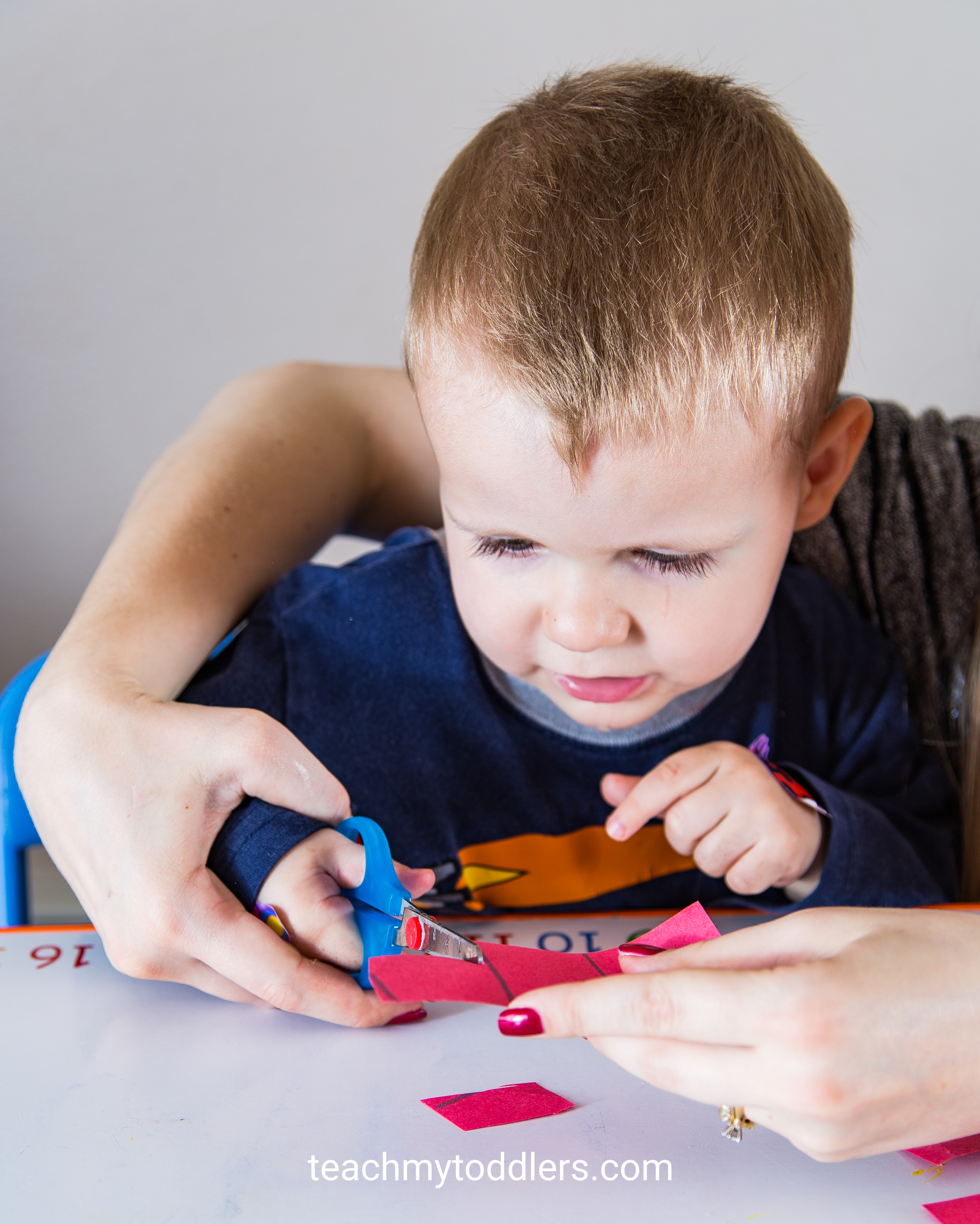 Use this fun cutting practice to teach toddlers shapes