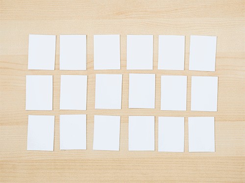 Cards laid out for a General Conference prophet matching game for toddlers