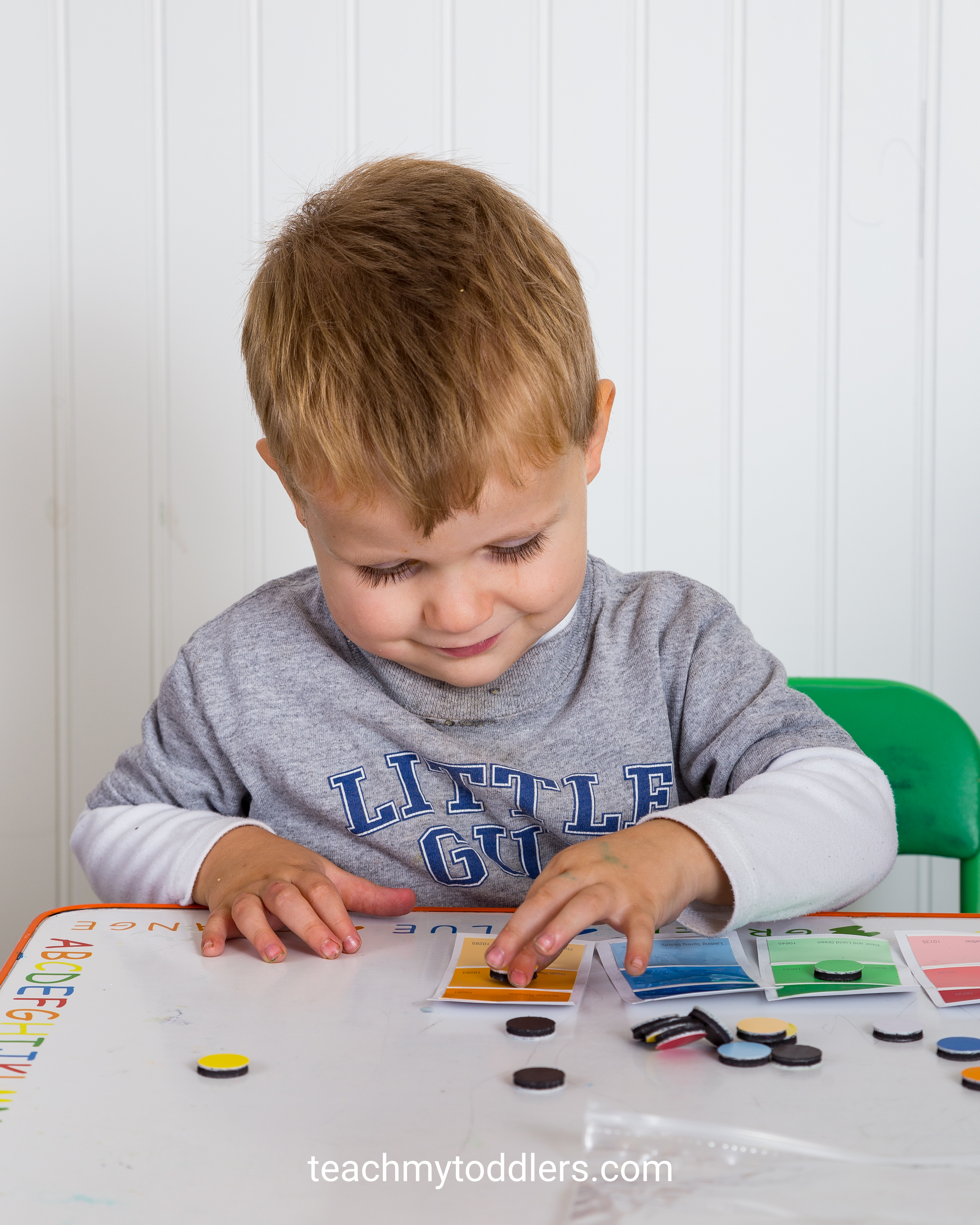 A fun matching game to teach your toddlers colors using paint chips