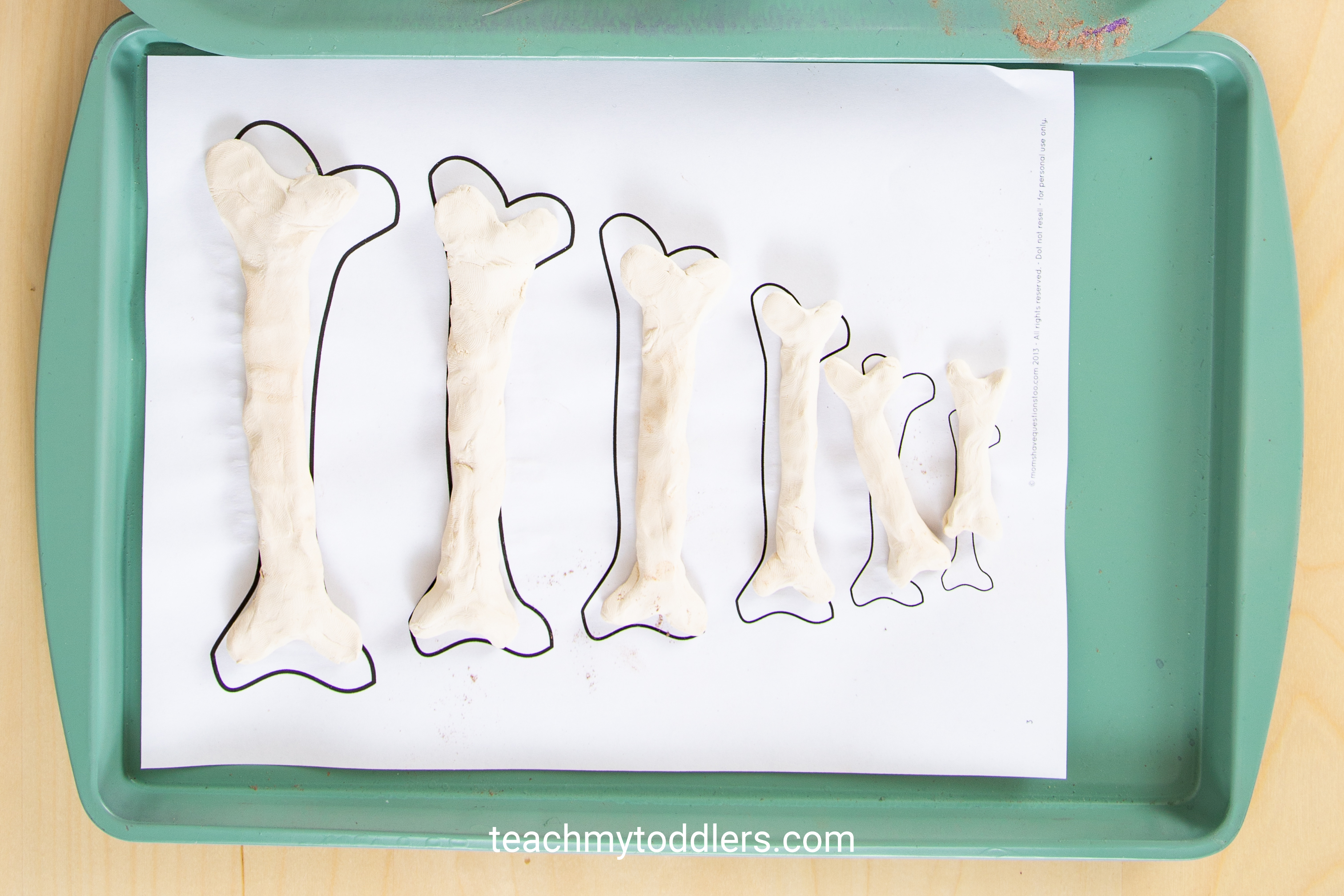 These toddler trays are fun for teaching your toddler the letter e is for extinct